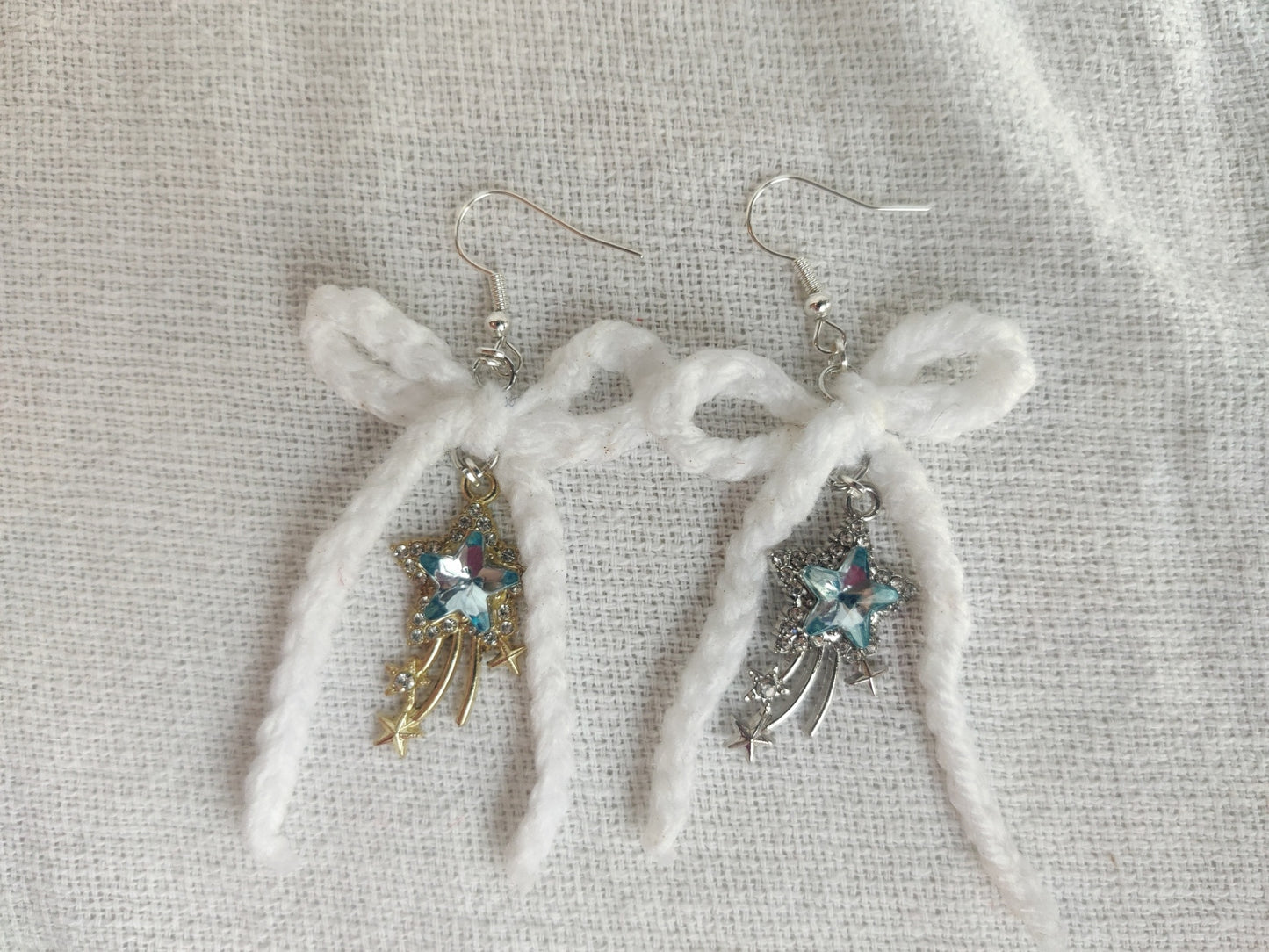 White crochet bows with sparkly star charms