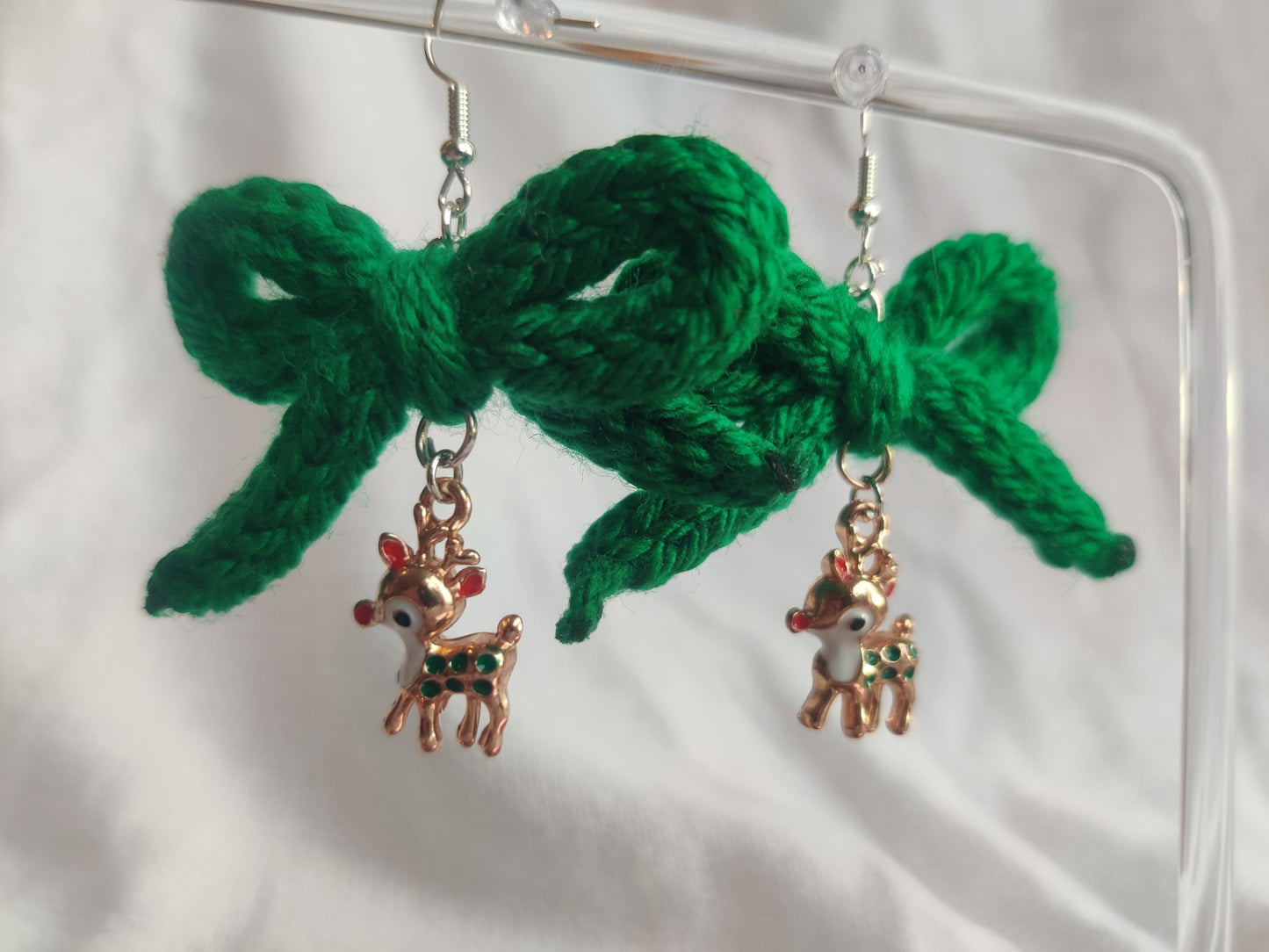 Crochet green bow earrings with reindeer charms