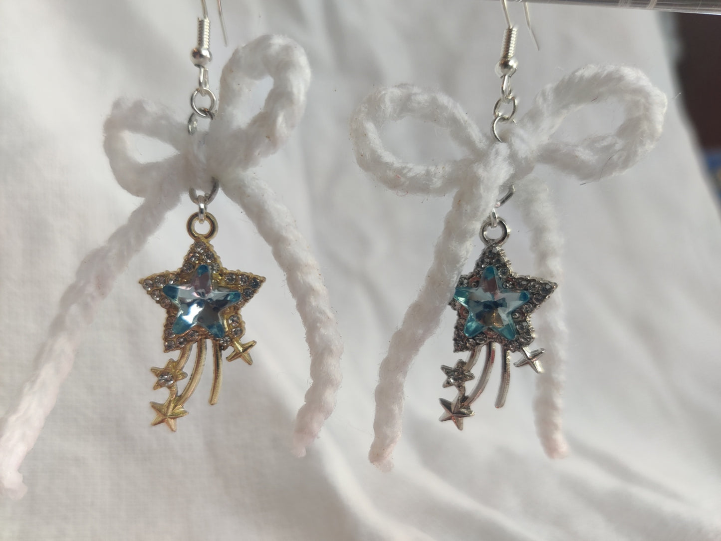 White crochet bows with sparkly star charms