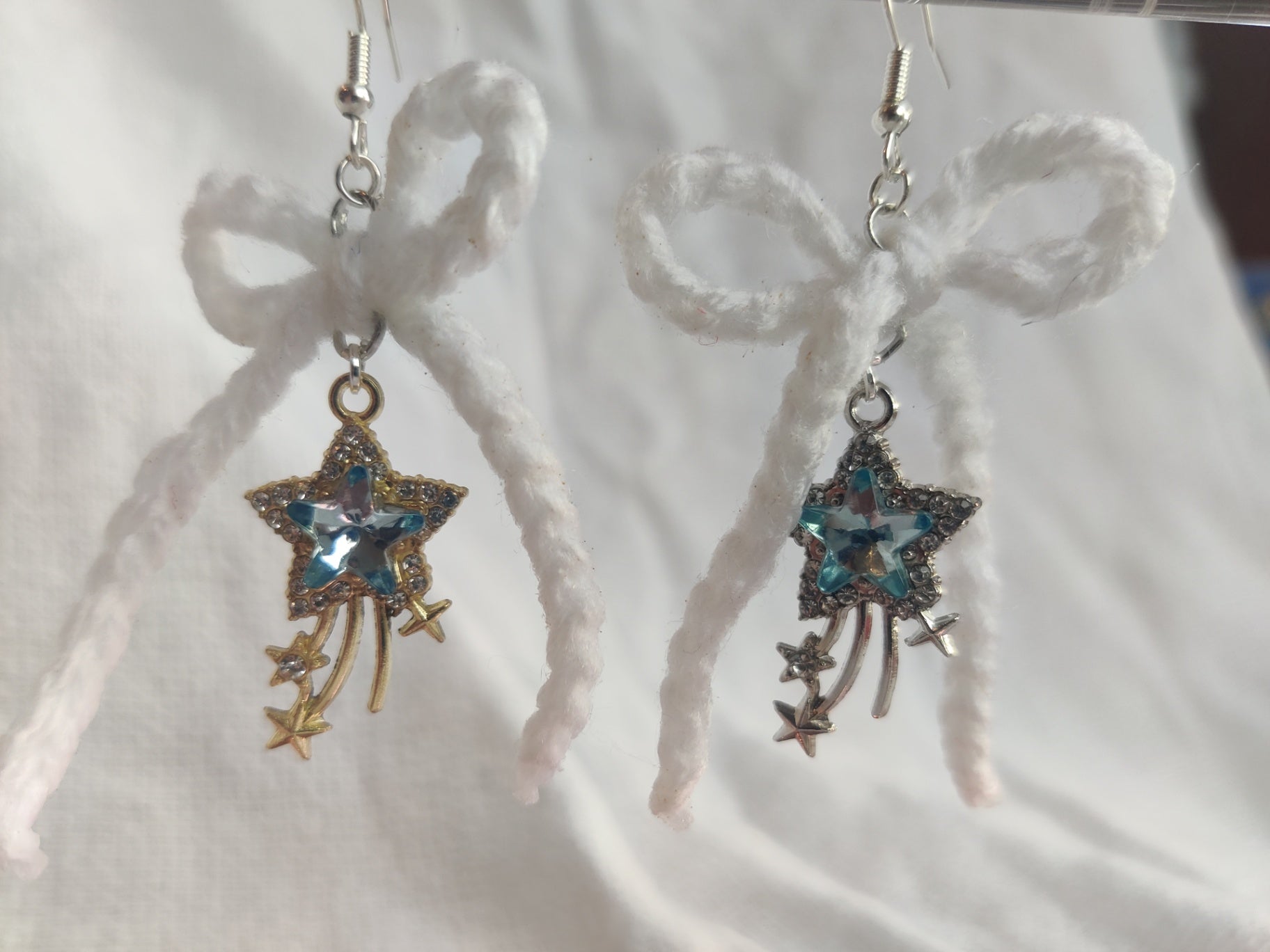 White crochet bows with sparkly star charms