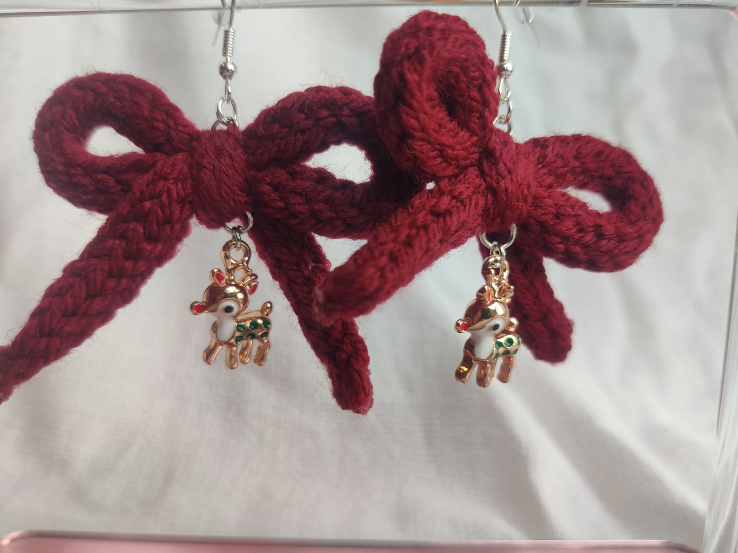 Crochet burgundy bow earrings with reindeer charms