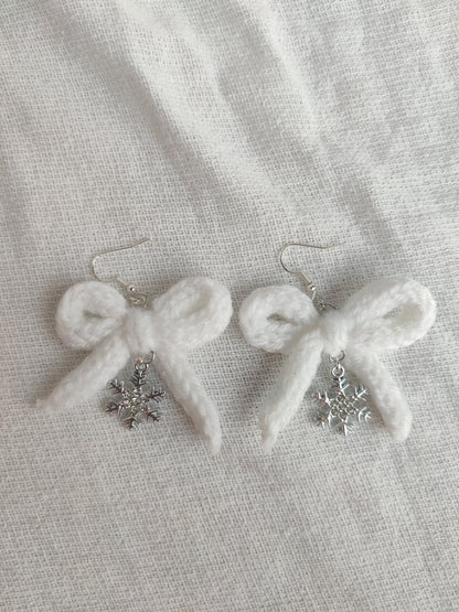 White crochet bows with sparkly snowflake charms