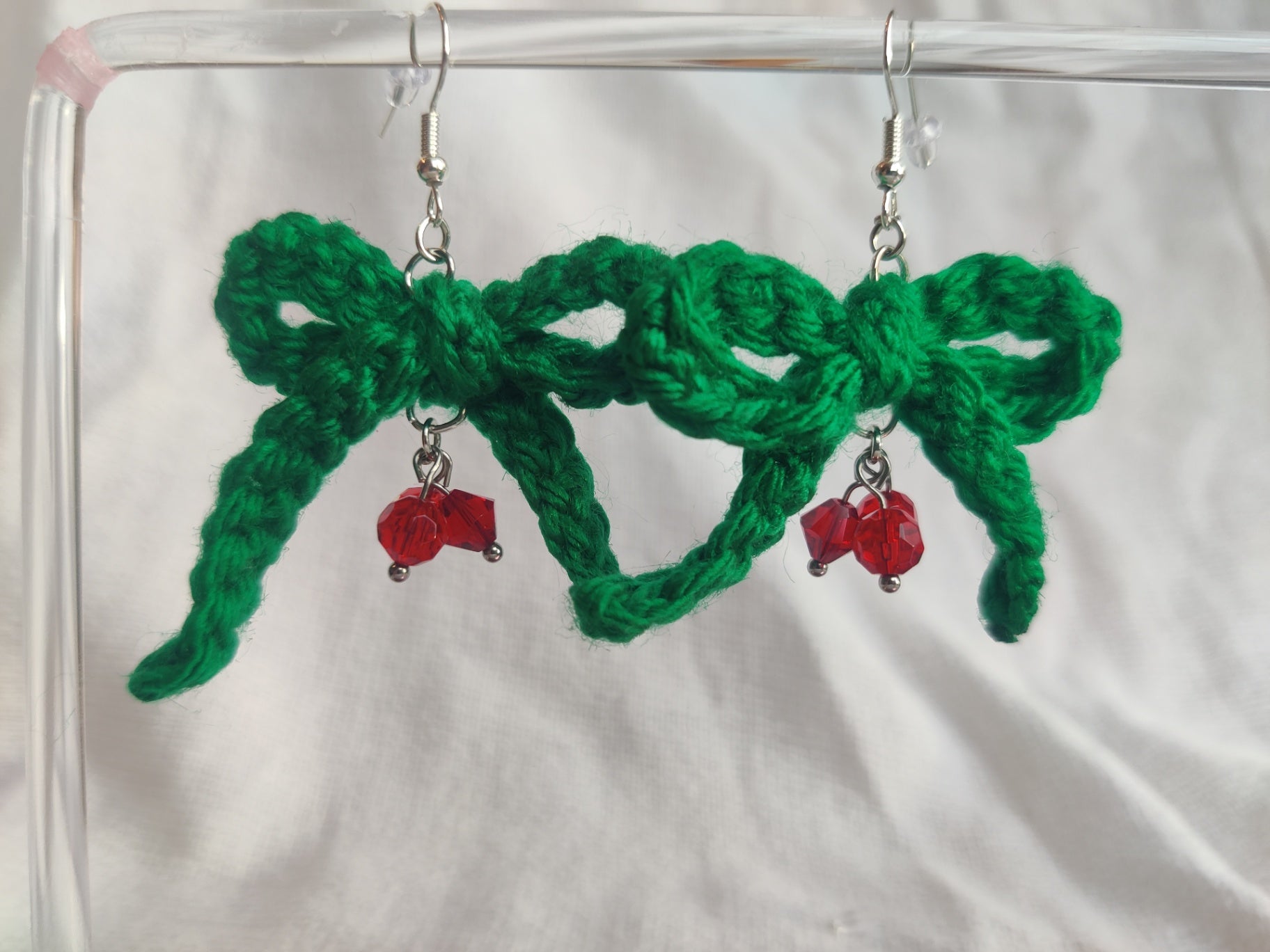 Crochet green bow earrings with red glass beads, holly berry