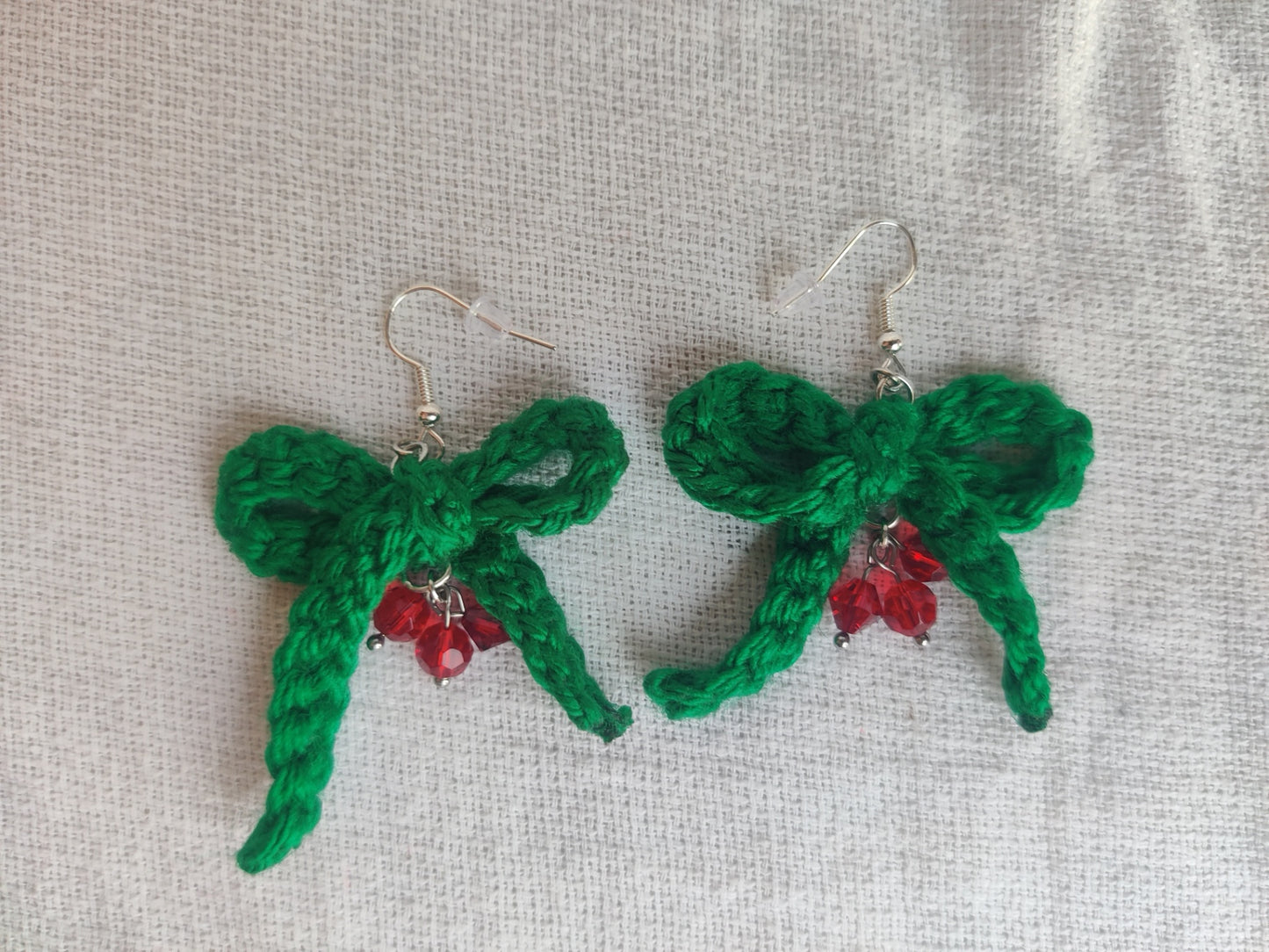 Crochet green bow earrings with red glass beads, holly berry