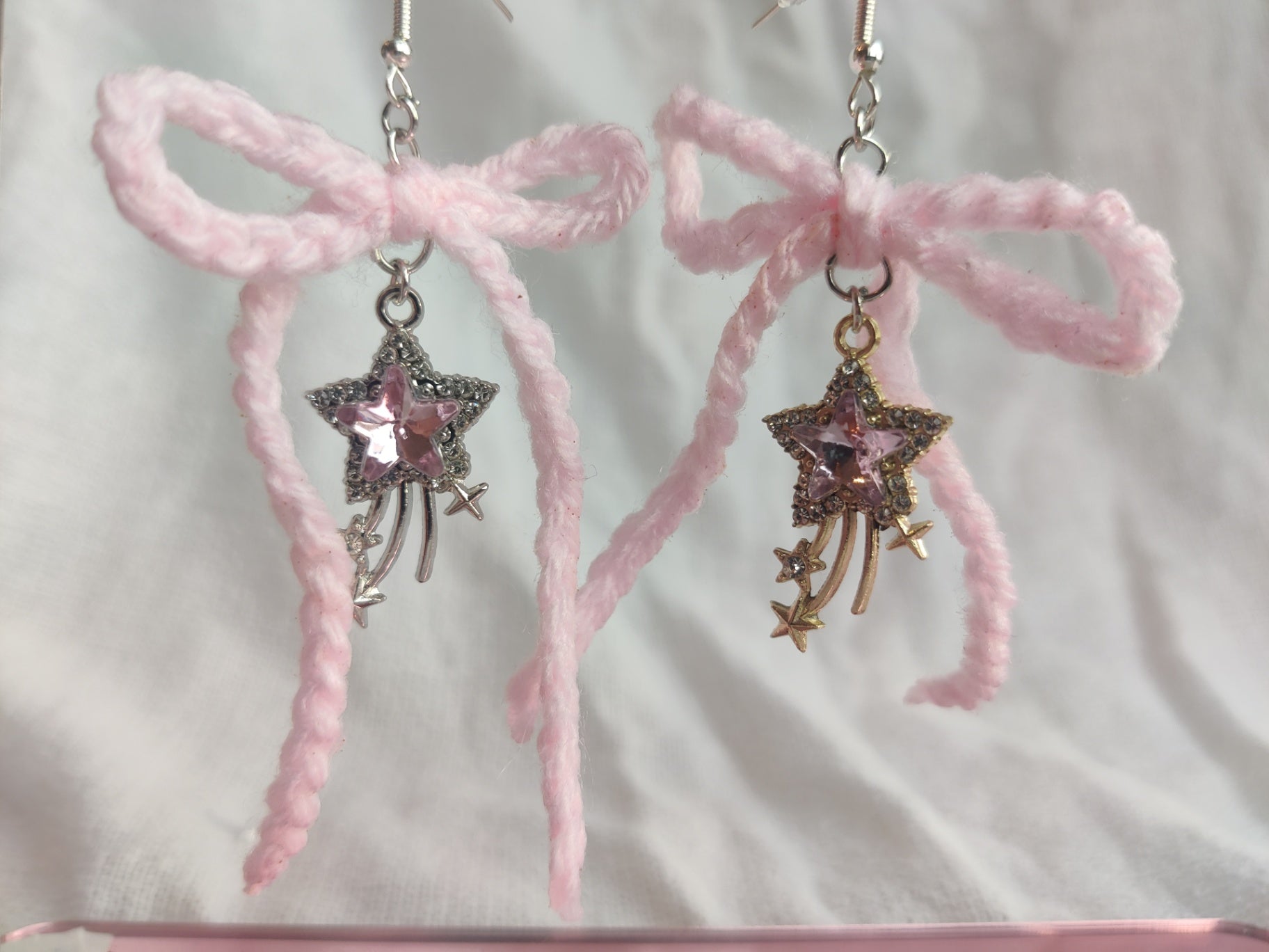 Crochet light pink bow earrings with star charms