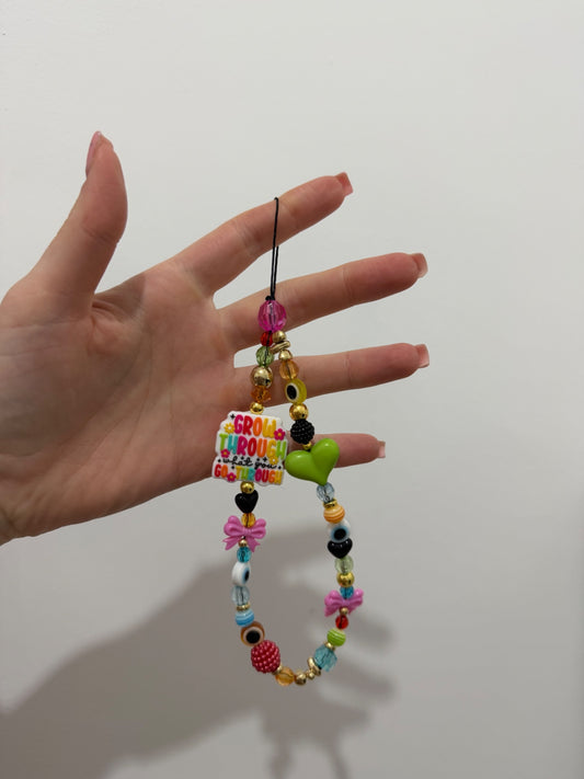 ‘Grow through’ phone charm - gold
