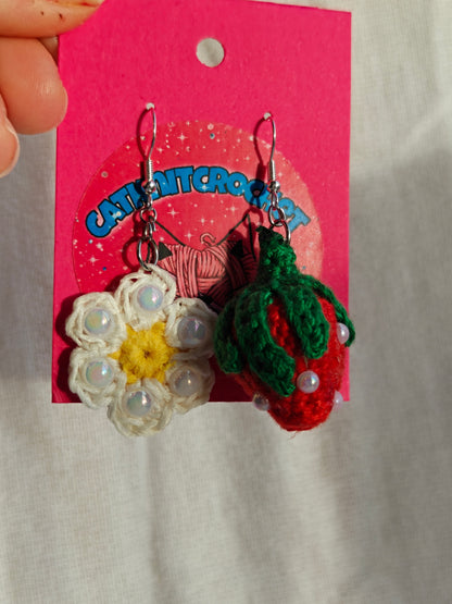 Mismatched earrings, strawberry and flower