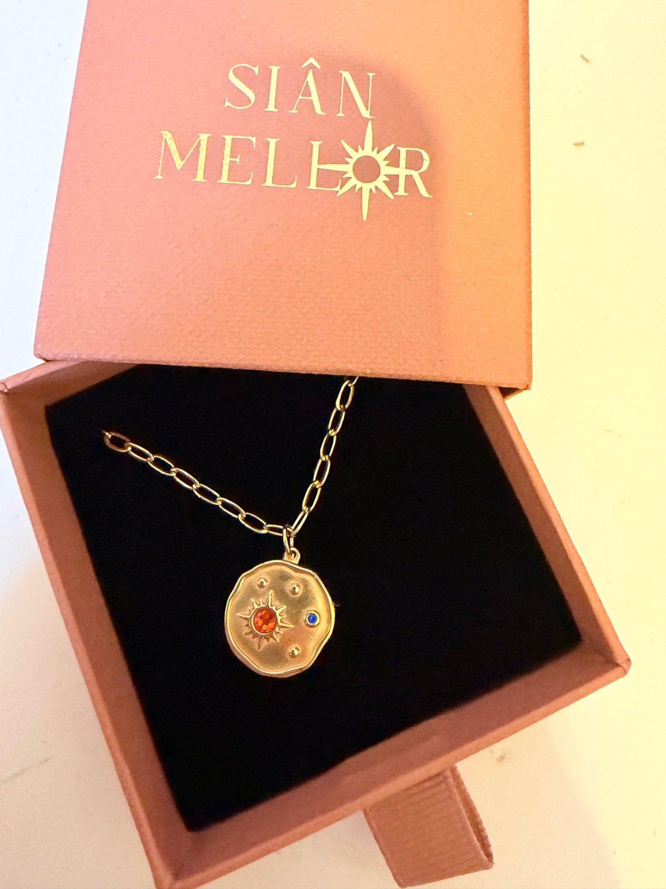 Gold celestial pendant 