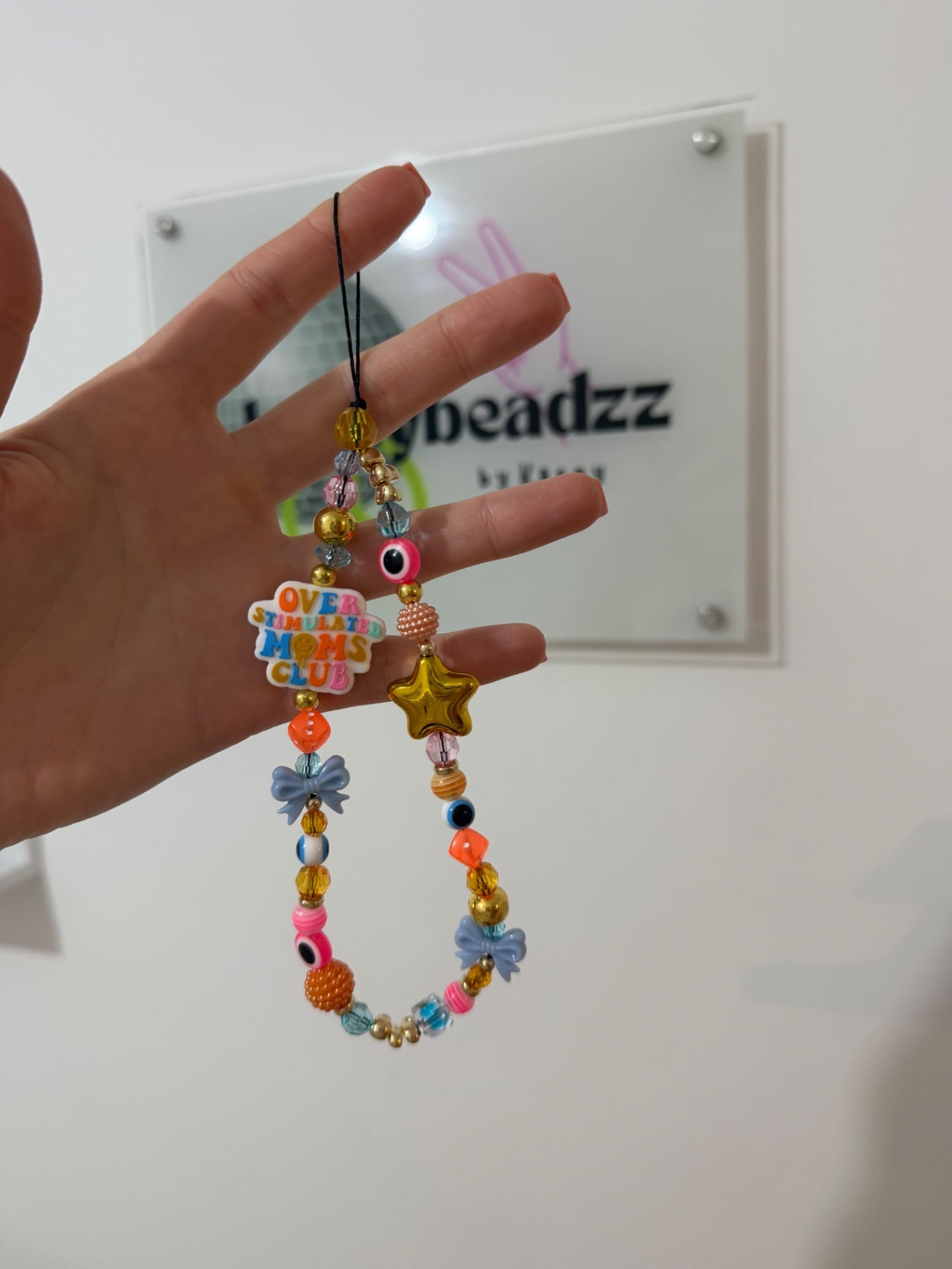 ‘Overstimulated mum club’ phone charm