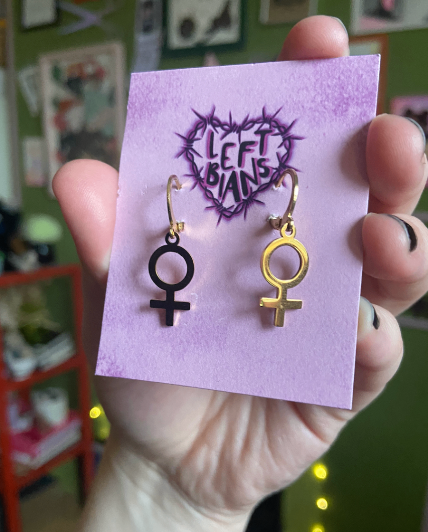 Gold venus symbol huggie hoop earrings 
