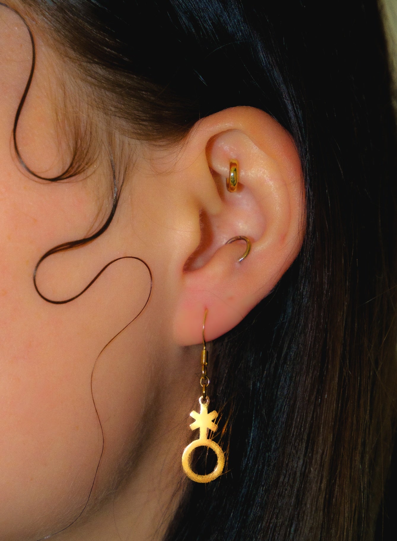 Gold non binary symbol earrings 