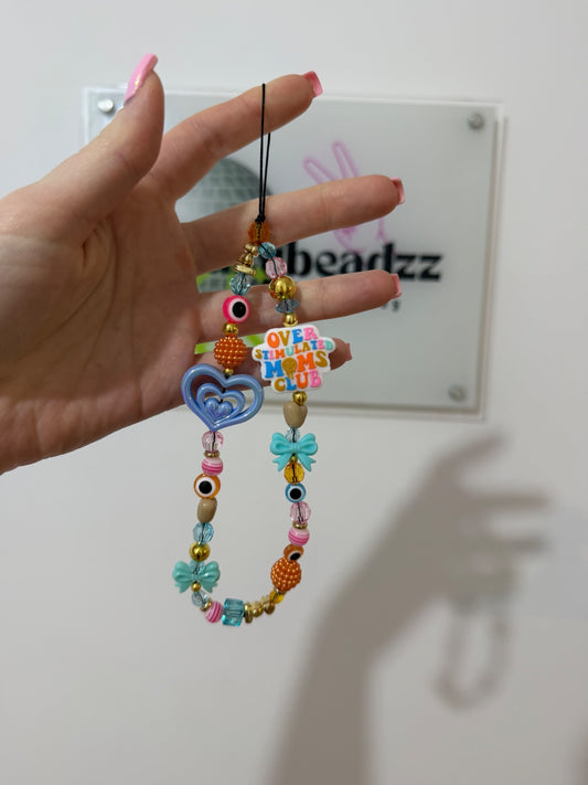 ‘Overstimulated mom club’ phone charm - gold