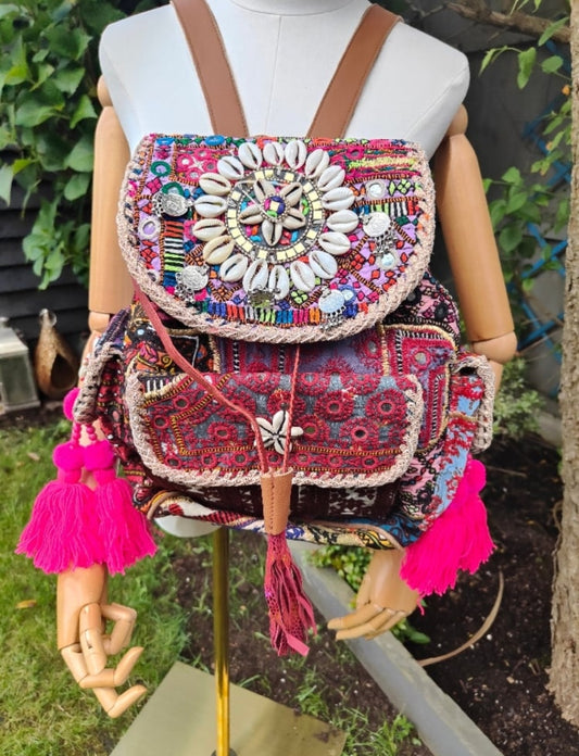 Skiathos backpack embellished with pom poms and charms