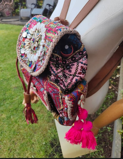 Skiathos backpack embellished with pom poms and charms