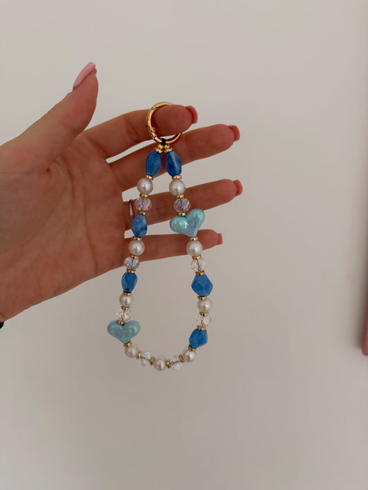‘Love is all around’ phone charm - blue