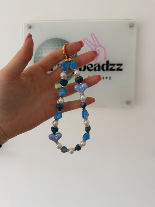 ‘Love is all around’ phone charm - blue