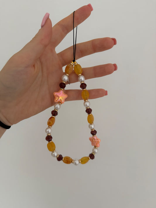 ‘Into the stars’ phone charm - orange/brown