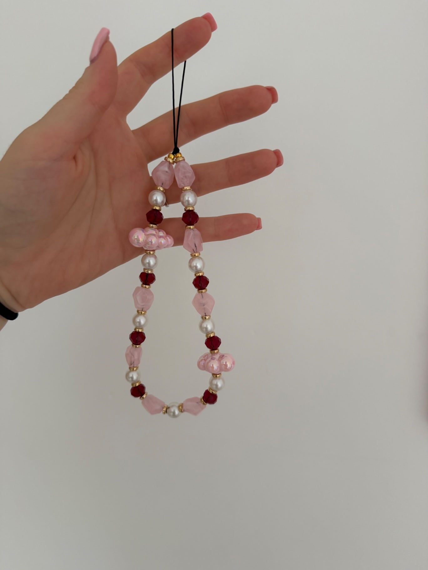 ‘In the clouds’ phone charm - pink/ burgendy