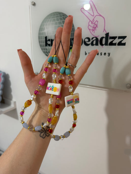 ‘Be the reason someone smiles today’ phone charm 
