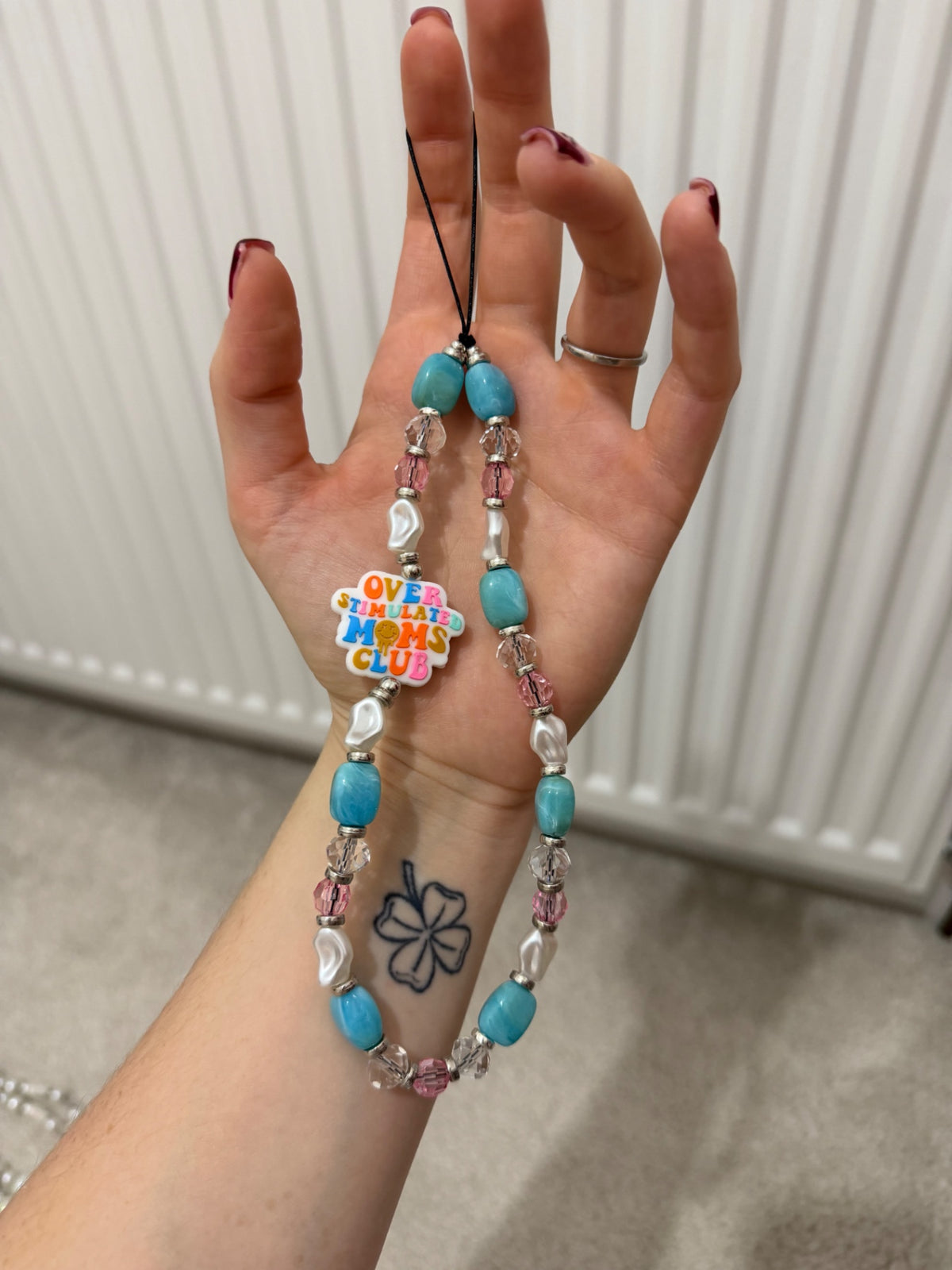 ‘Overstimulated moms club’ phone charm