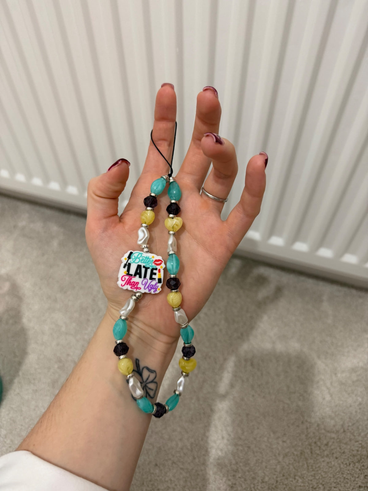 ‘Better late than ugly’ phone charm