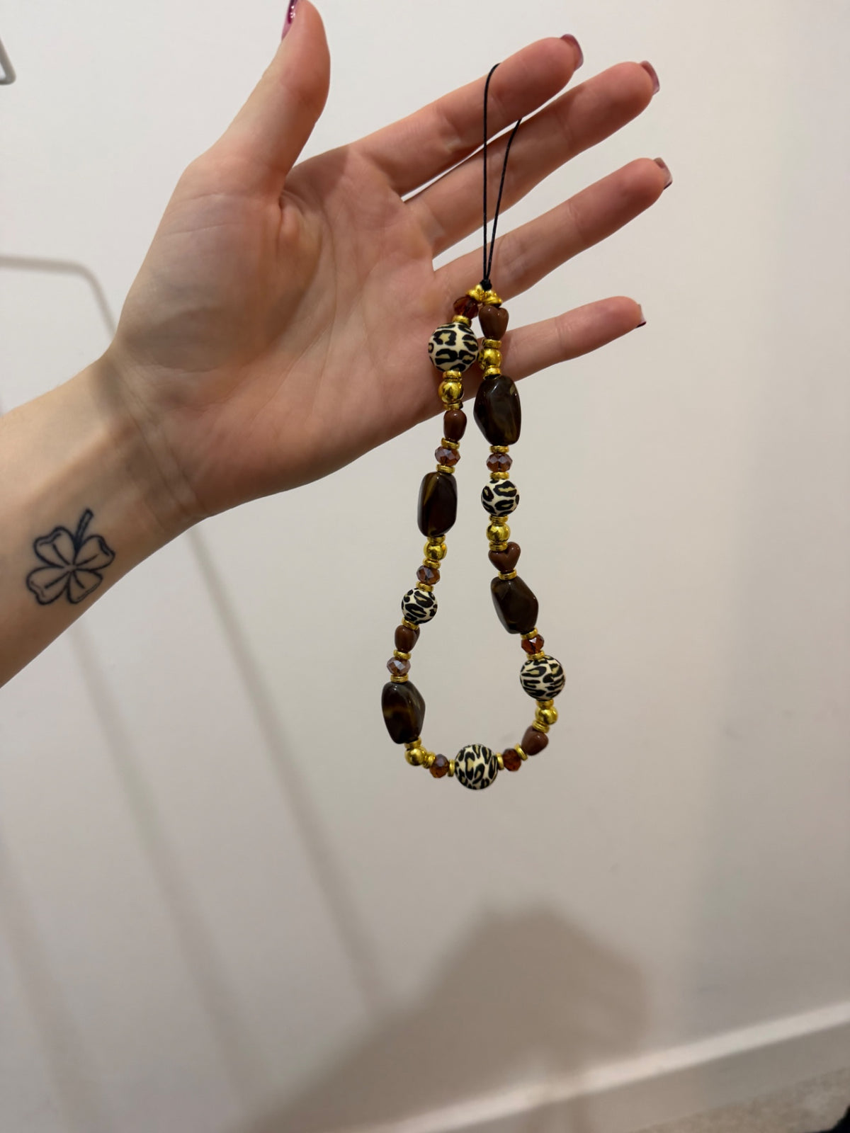 ‘Carol baskin’ phone charm - gold