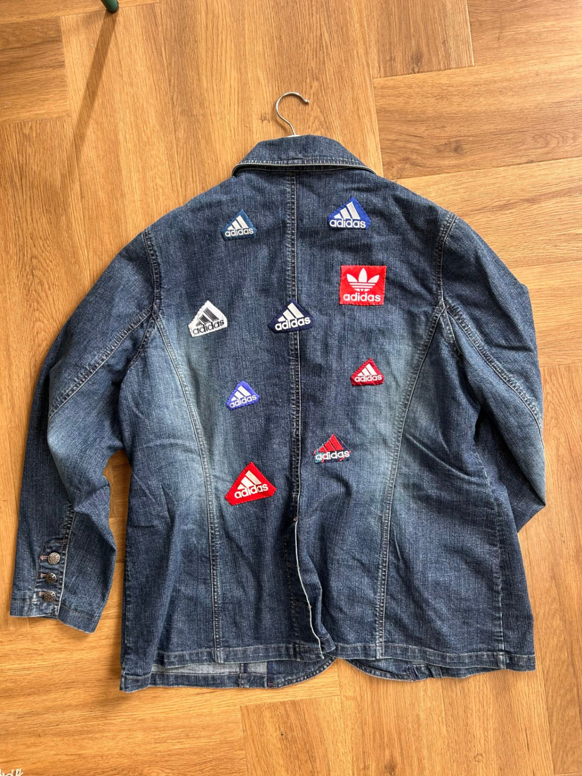 Upcycled denim jacket with adidas patches